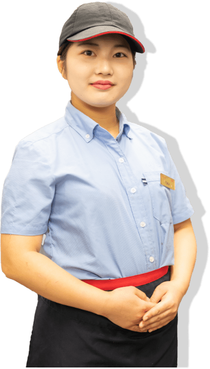 ○○店舗所属の女性スタッフ。帽子とユニフォームを着用。
